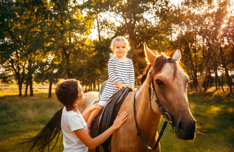 Horseback riding at Creeks Crossing Cabins.