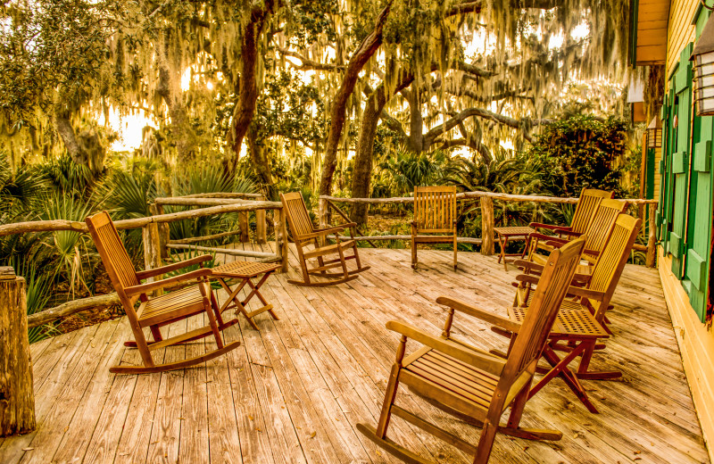 Comfortable rocking chairs on the Hunting Lodge patio at the Lodge on Little St. Simons Island.