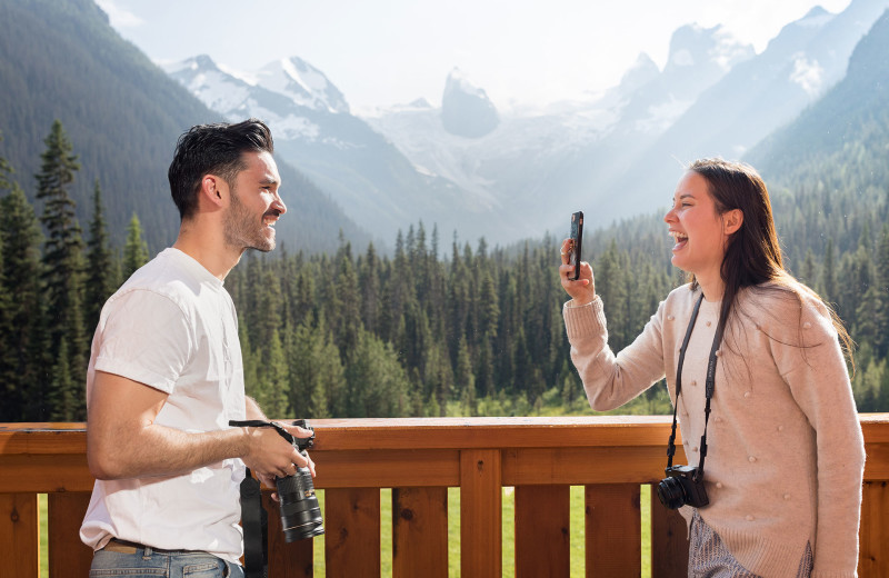 Couple on balcony at CMH Bugaboos Lodge.