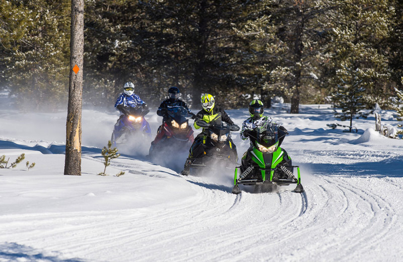 Snowmobiling at Wild Skies Cabin Rentals.