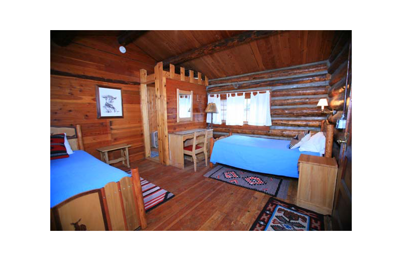 Cabin bedroom at Rimrock Dude Ranch.