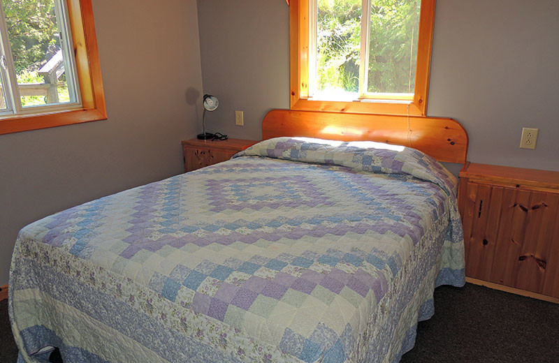 Cottage bedroom at Angel Rock Waterfront Cottages.