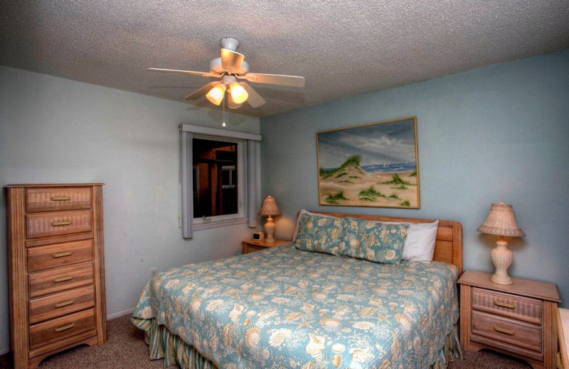 Vacation rental bedroom at Sand Cay Beach Resort.