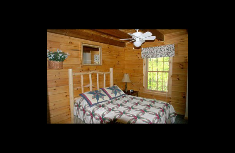 Cabin bedroom at Hummingbird Hill Cabin Rentals.