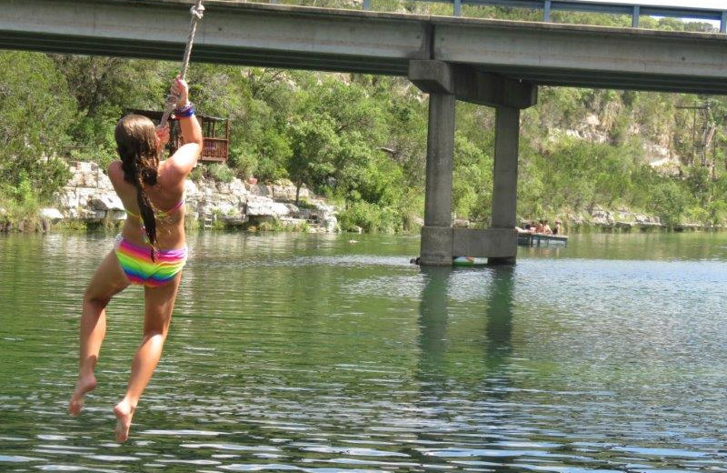 Jumping in river at Mo-Ranch.