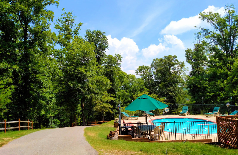 Outdoor pool at Lake Forest Luxury Log Cabins.