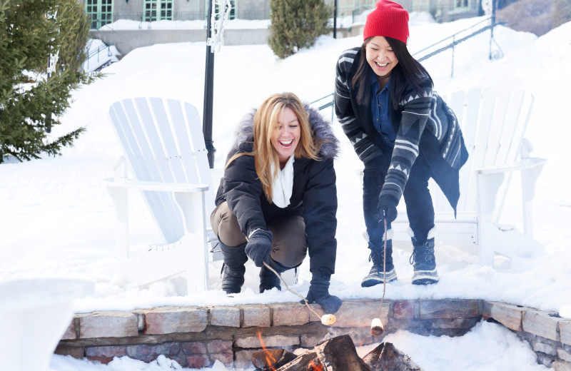 Couple by the fire at Fairmont Le Manoir Richelieu.