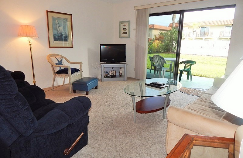 Rental living room at Family Sun Vacation Rentals.