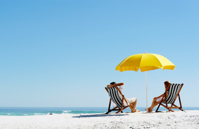 Couple on beach at Bender Realty Vacation Rentals.