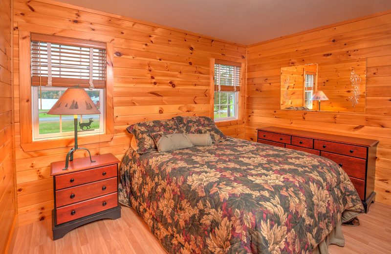 Meticulously clean country-style decorative chalet bedroom at Jackson's Lodge and Log Cabin Village, Canaan, Vermont' Northeast Kingdom.