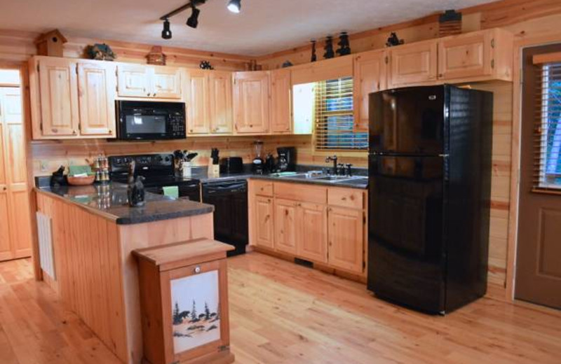 Cabin kitchen at Mountain Getaway Cabin Rentals.