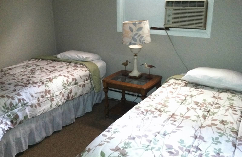 Cabin bedroom at Lake Breeze Resort.