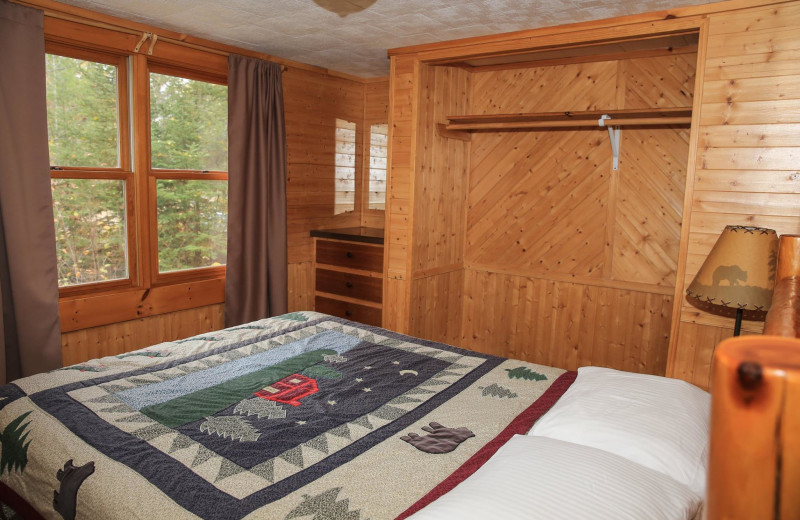 Cabin bedroom at Timber Trail Lodge & Resort.