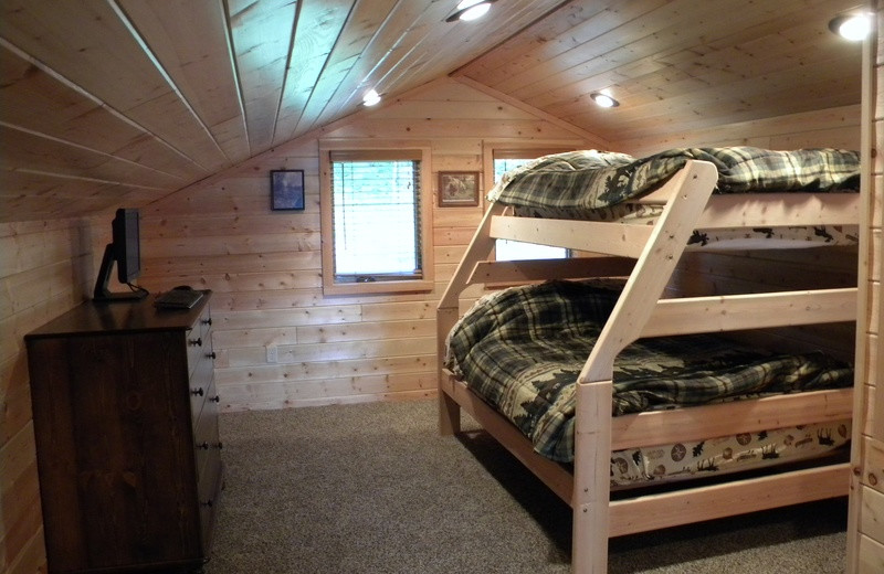 Cabin bedroom at Crane Lake Wilderness Lodge.