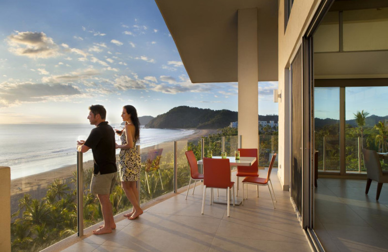 Couple on balcony at Costa Rica Luxury Lifestyle.