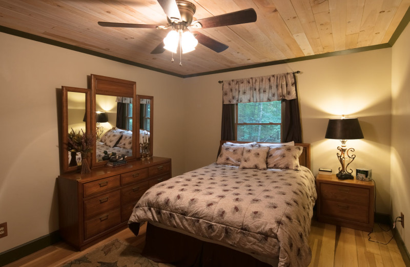 Cabin bedroom at Blue Ridge Vacation Cabins. 