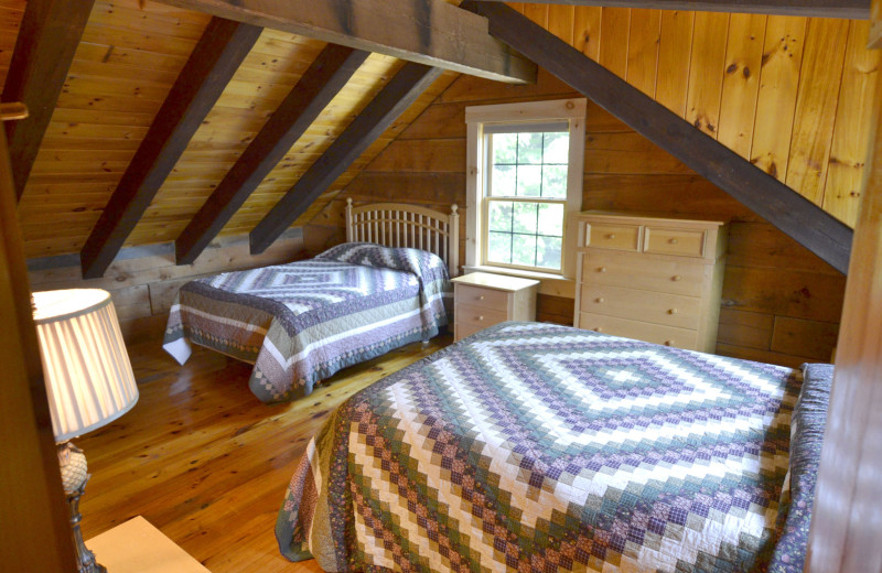 Cabin bedroom at The New England Inn & Lodge.