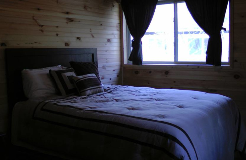 Cabin bedroom at The Woods At Bear Creek Glamping Resort.