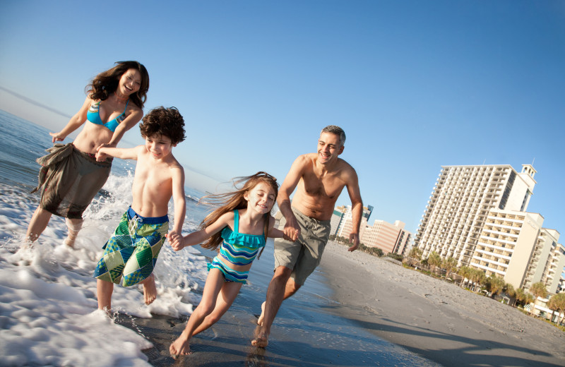 Family on beach at The Breakers Resort.