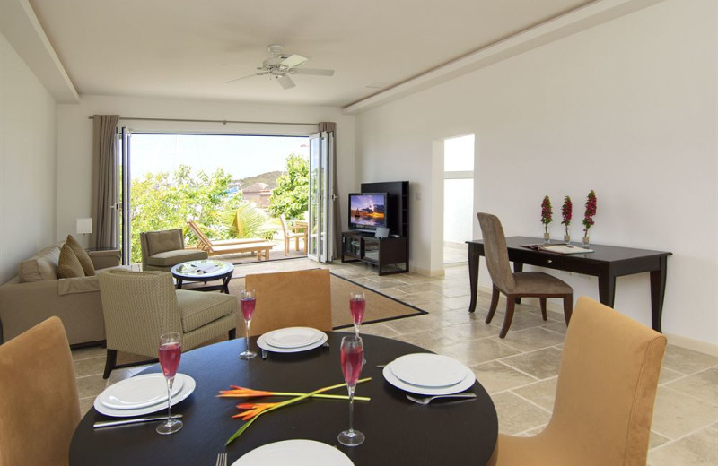 Vacation rental dining and living room at Coral Beach Club.