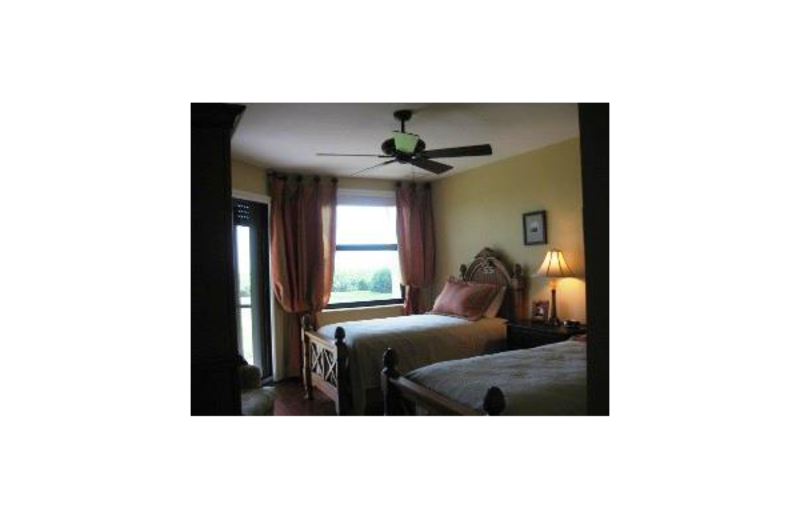 Vacation rental bedroom at Sunshine Resort Rentals, LLC.