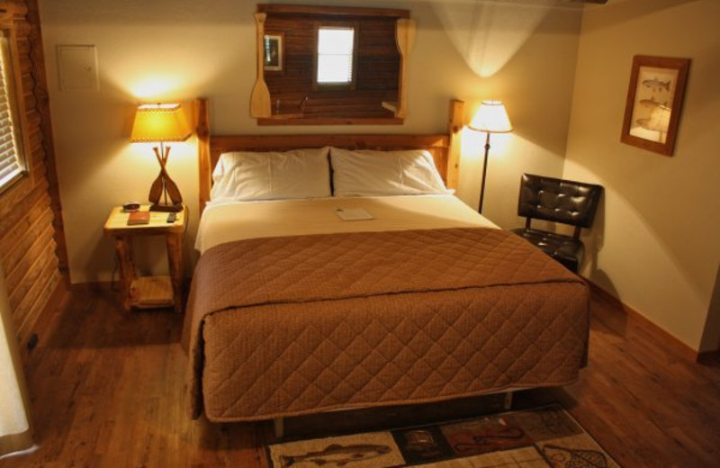 Cabin bedroom at Lindsey's Rainbow Resort.