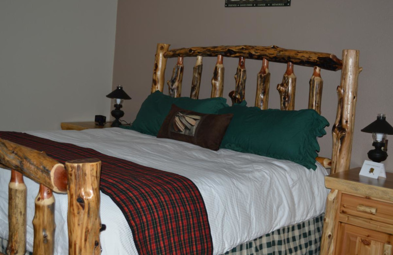Cabin bedroom at Summit Lake Lodge.