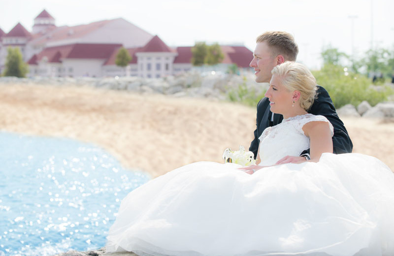 Wedding couple on our Lake Michigan beach at Blue Harbor Resort.