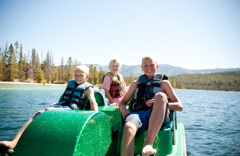 Family paddle boating at Redfish Lake Lodge.