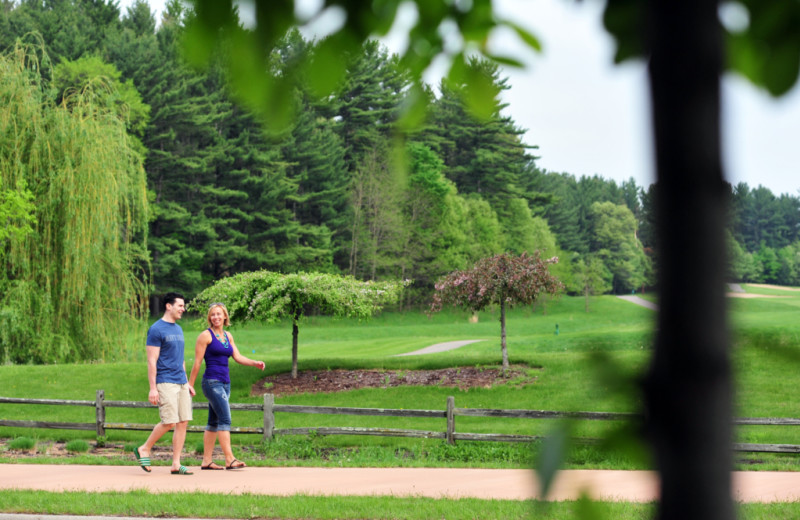 Couple walking at Baker's Sunset Bay Resort.