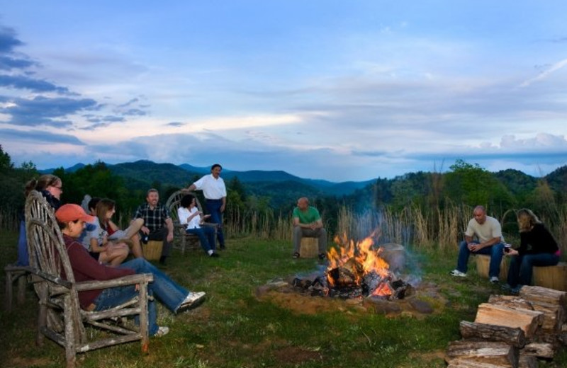 Family at a bonfire at Splendor Mountain.