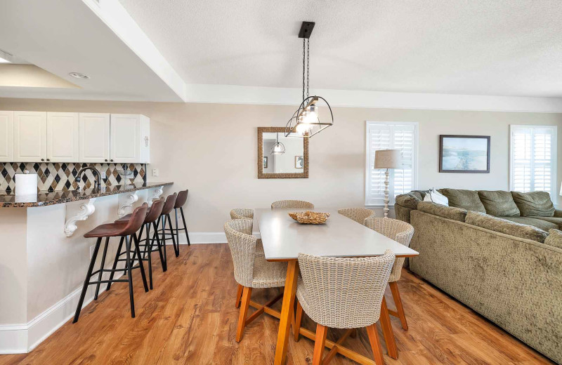 Kitchen and dining area at Real Escapes Properties - St. Simons Grand 307.