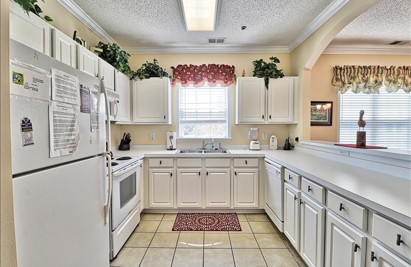 Rental kitchen at Barefoot Resort Rentals.