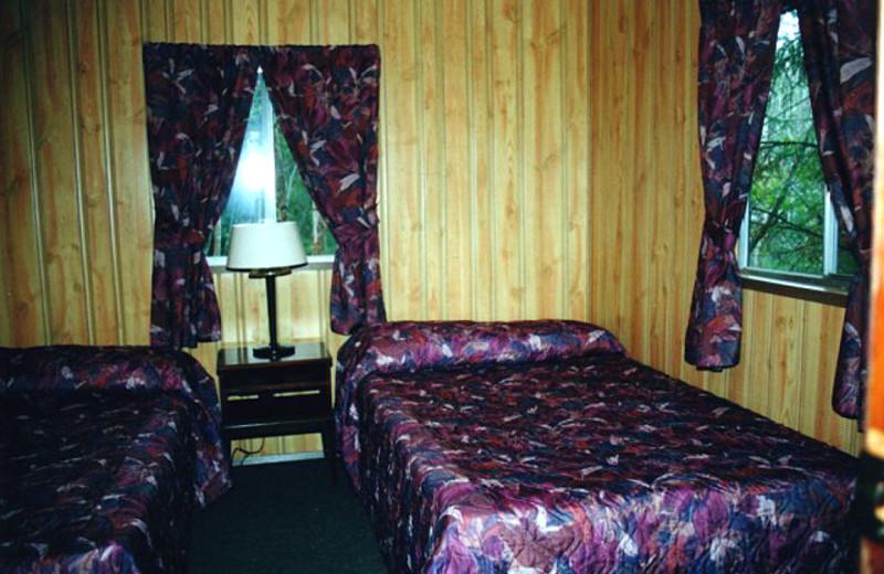 Cabin bedroom at Uchi Lake Lodge.