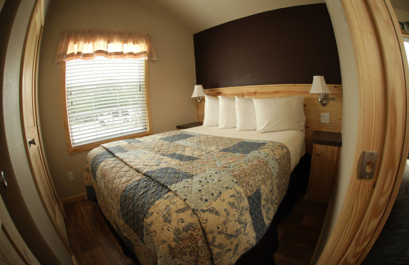 Cottage bedroom at Hill Country RV Resort & Cottage Rentals.