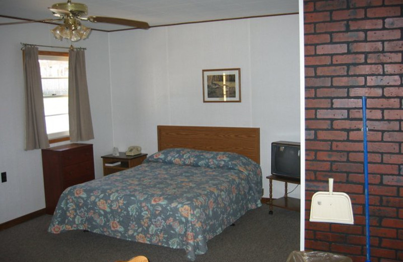 Cabin bedroom at Golden Arrow Resort.