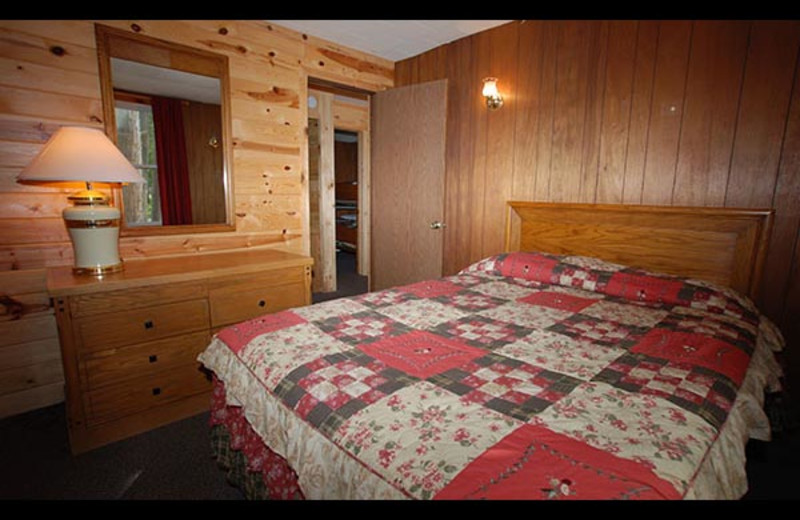 Cabin bedroom at Isle O' Dreams Lodge.