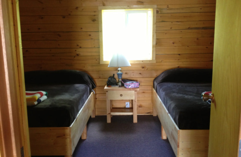 Cabin bedroom at Maynard Lake Lodge and Outpost.