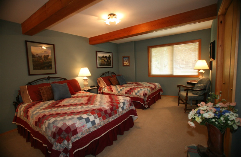Cabin bedroom at Western Pleasure Guest Ranch.