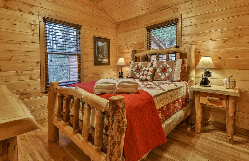 Cabin bedroom at Mountain Oasis Cabin Rentals.