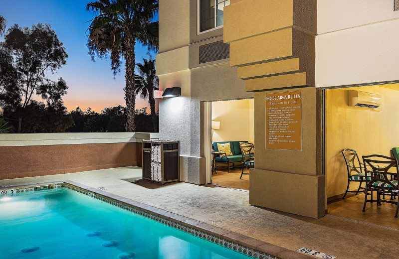 Outdoor pool at Candlewood Suites Anaheim - Resort Area, an IHG Hotel.