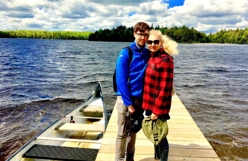 Couple on dock at Algonquin Log Cabin.