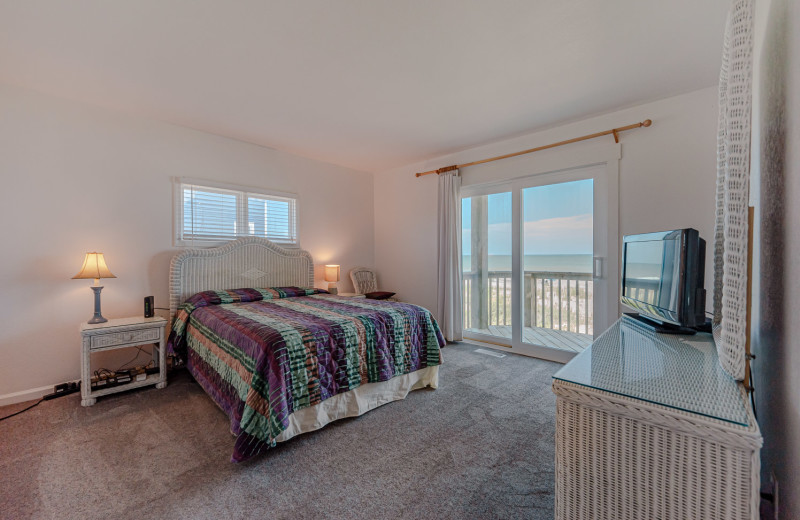 Rental bedroom at Joe Lamb Jr. & Associates Vacation Rentals.