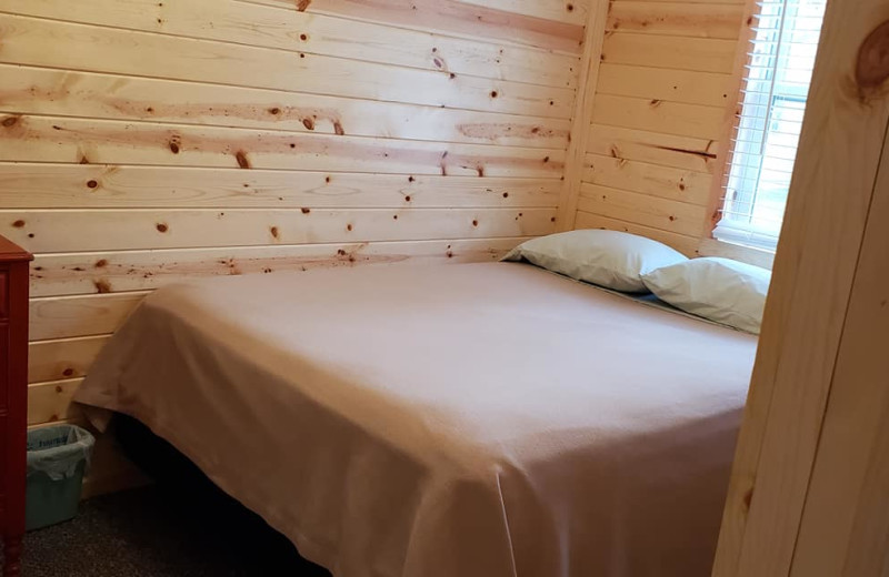 Cabin bedroom at Cozy Bay Resort.