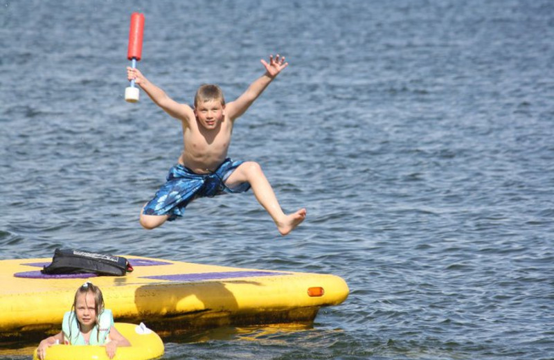 Jumping in the lake at Barky's Resort.