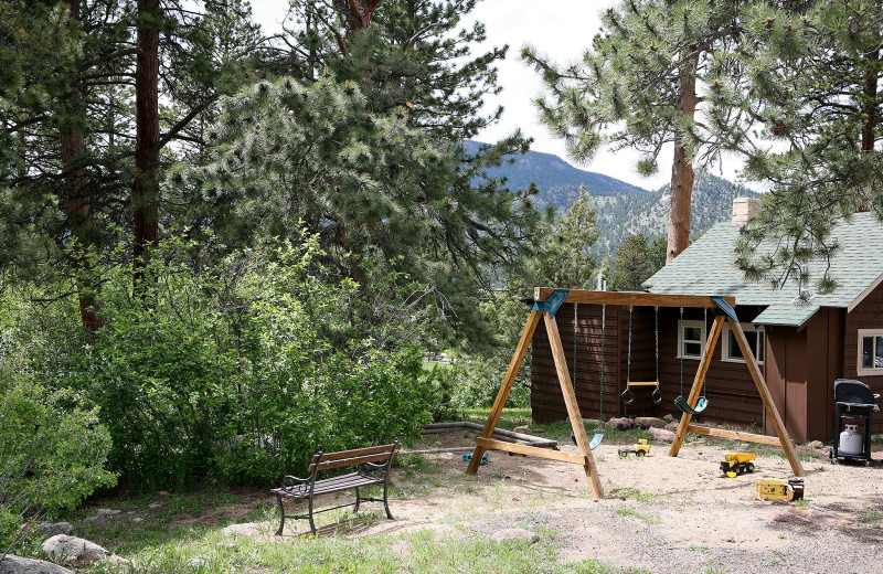 Cottage kid's playground at Lazy R Cottages.