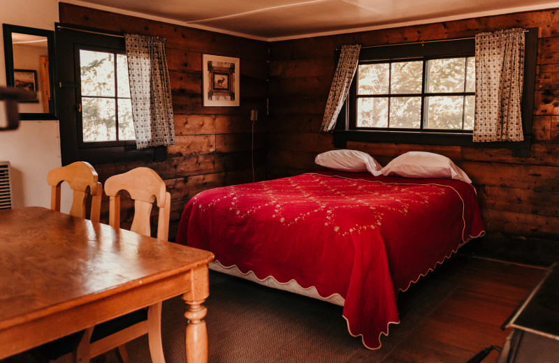 Cabin bed at Trappers Lake Lodge & Resort.