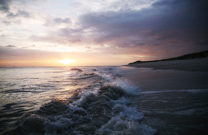 Beach sunset at Bald Head Island Limited.