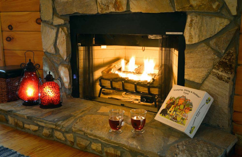 Cabin fireplace at Black Bear Cabin Rentals.