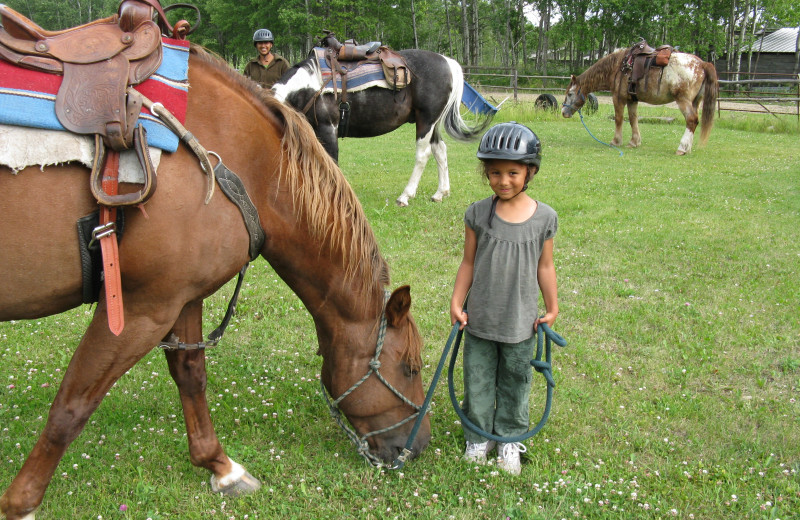 Kids with horses at Trailhead Ranch.